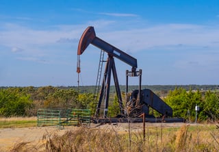 Oil pumpjack operating in an Oklahoma oil field, representing energy production and regulatory reporting requirements.